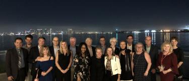 Group of adults with San Diego Skyline
